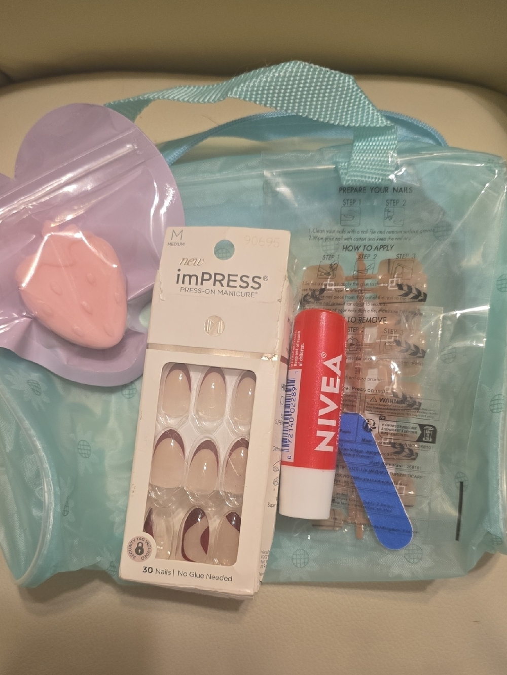 imPRESS Nude Press-On Nails with Burgundy Tip Accents and NIVEA Lip Balm